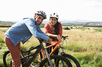 Happy couple on their bikes