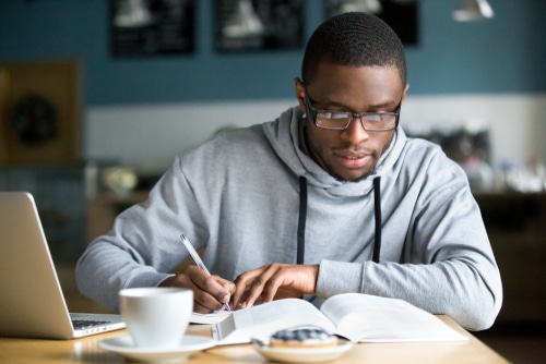 man studying at desk