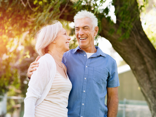 Happy older couple outside