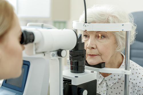 Lady receiving cornea exam