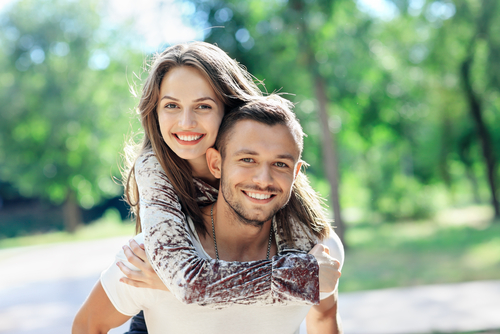 Couple smiling at camera. 