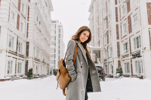 WOman outside in city winter time